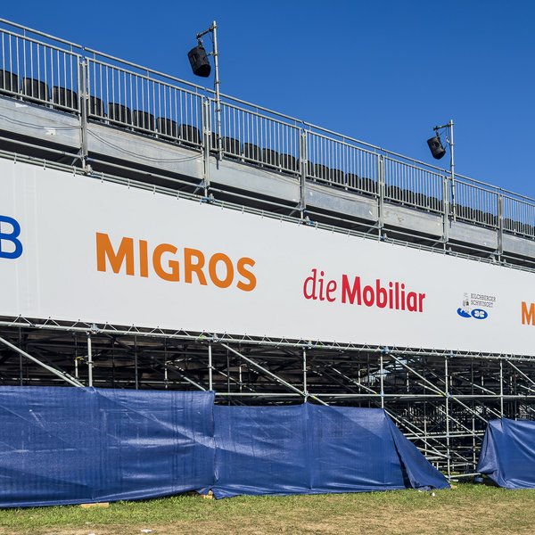 Close-up of the sponsor banner at the grandstand of the 18th Kilchberg Schwinget.