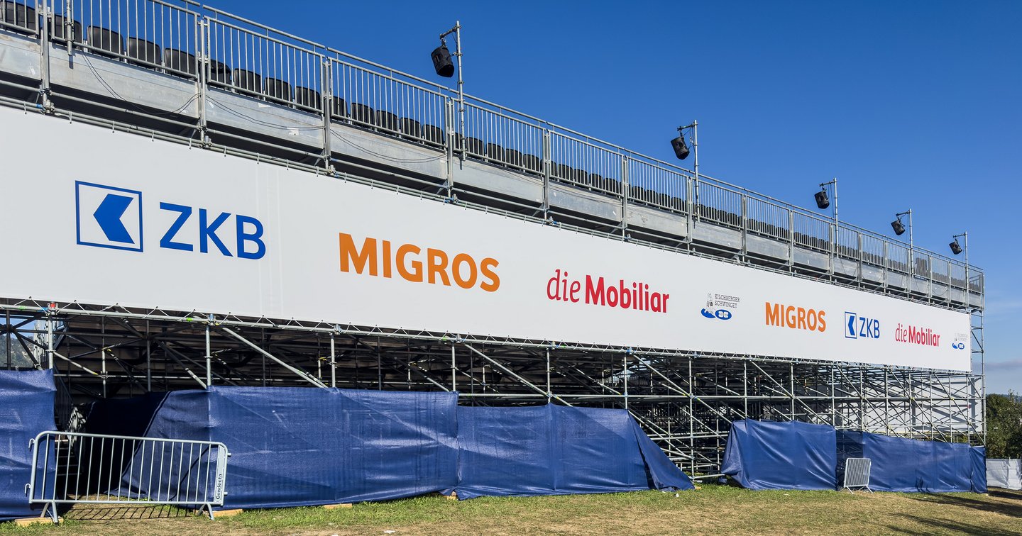 Close-up of the sponsor banner at the grandstand of the 18th Kilchberg Schwinget.