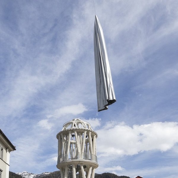 The Weisser Turm of Mulegns is unveiled from its textile cover with the help of a helicopter.