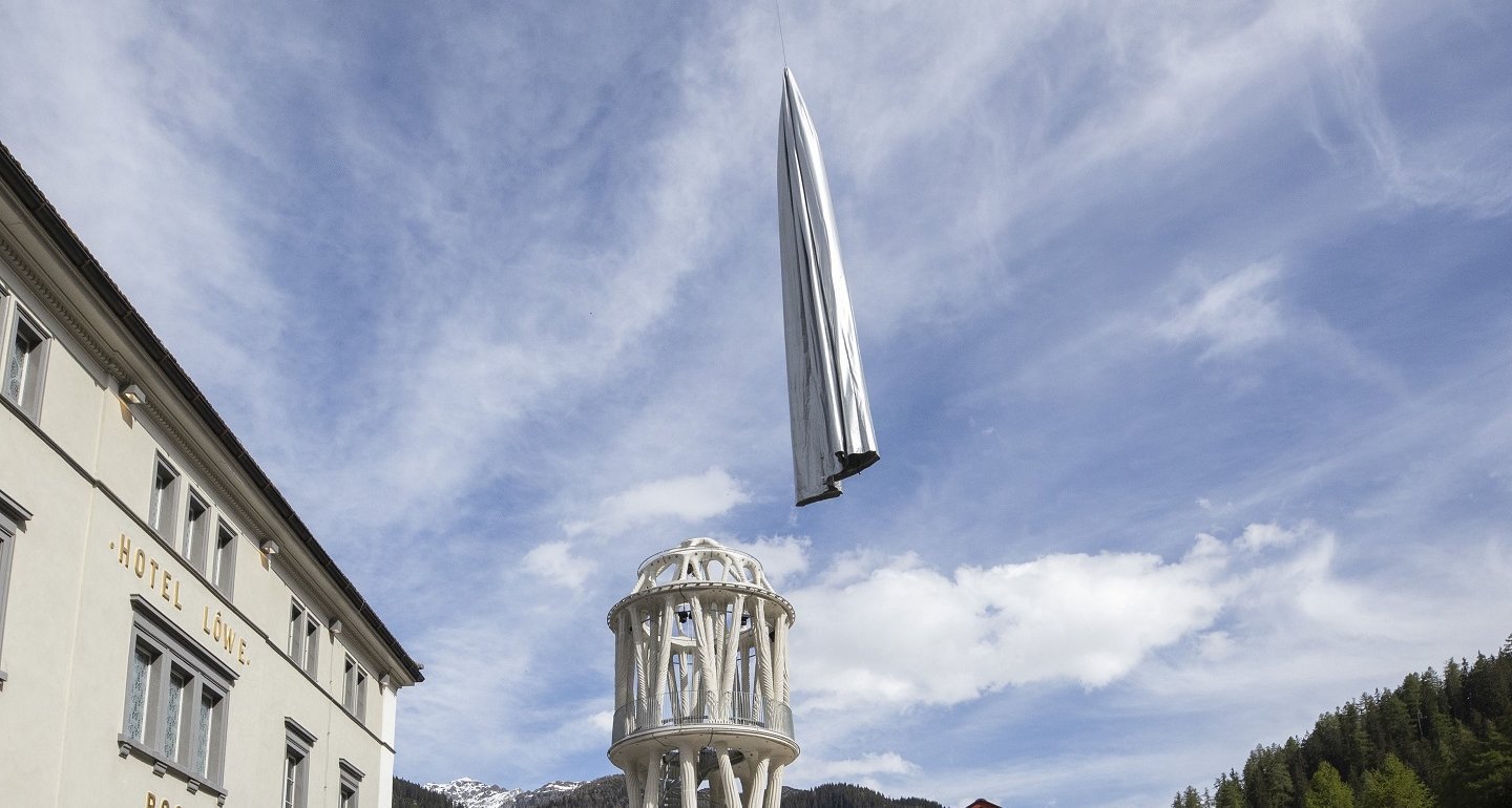 The Weisser Turm of Mulegns is unveiled from its textile cover with the help of a helicopter.