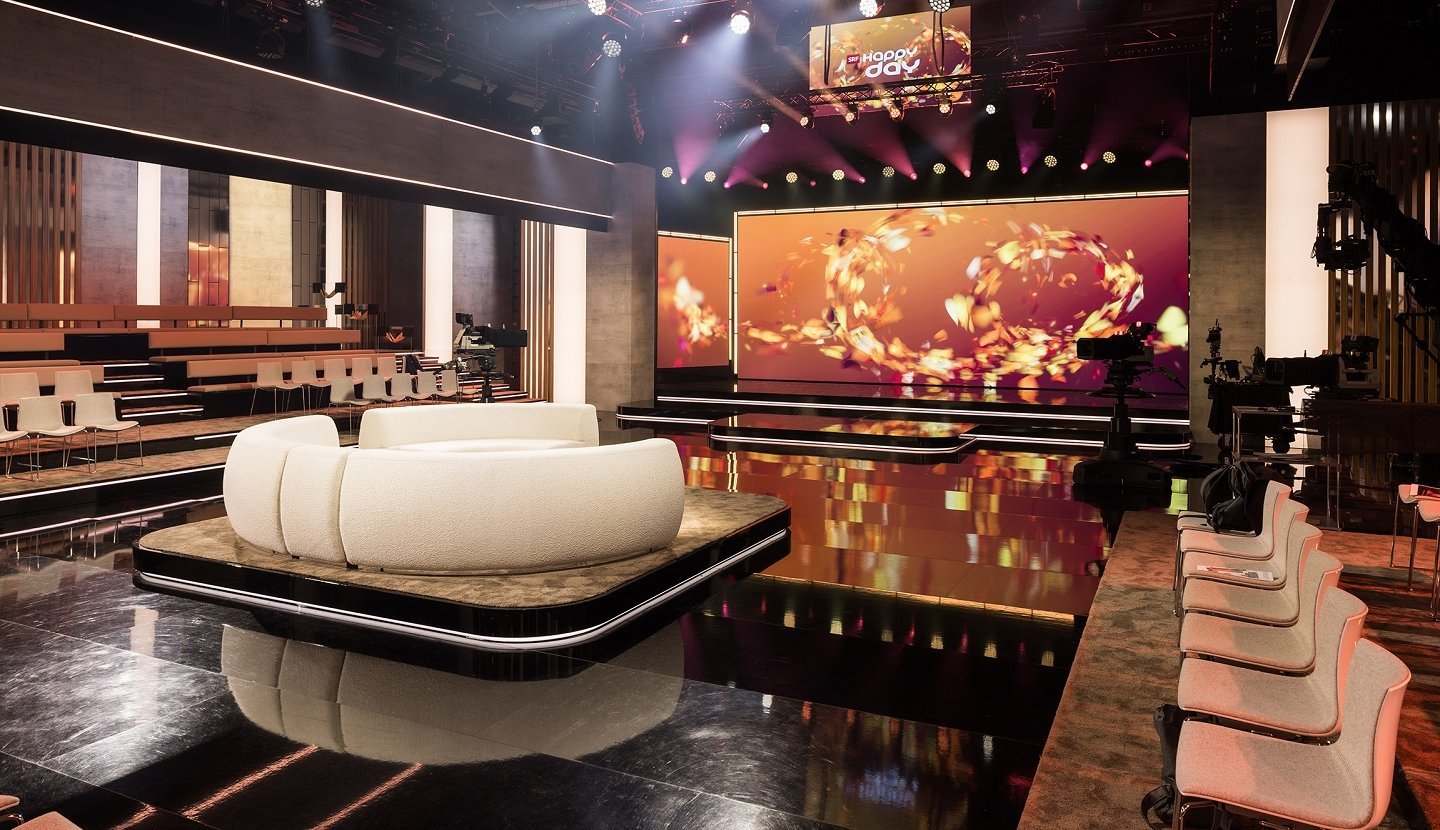 Lightboxes and textile elements in the new SRF «Happy Day» studio with precise illumination and modern studio design. Image source: SRF